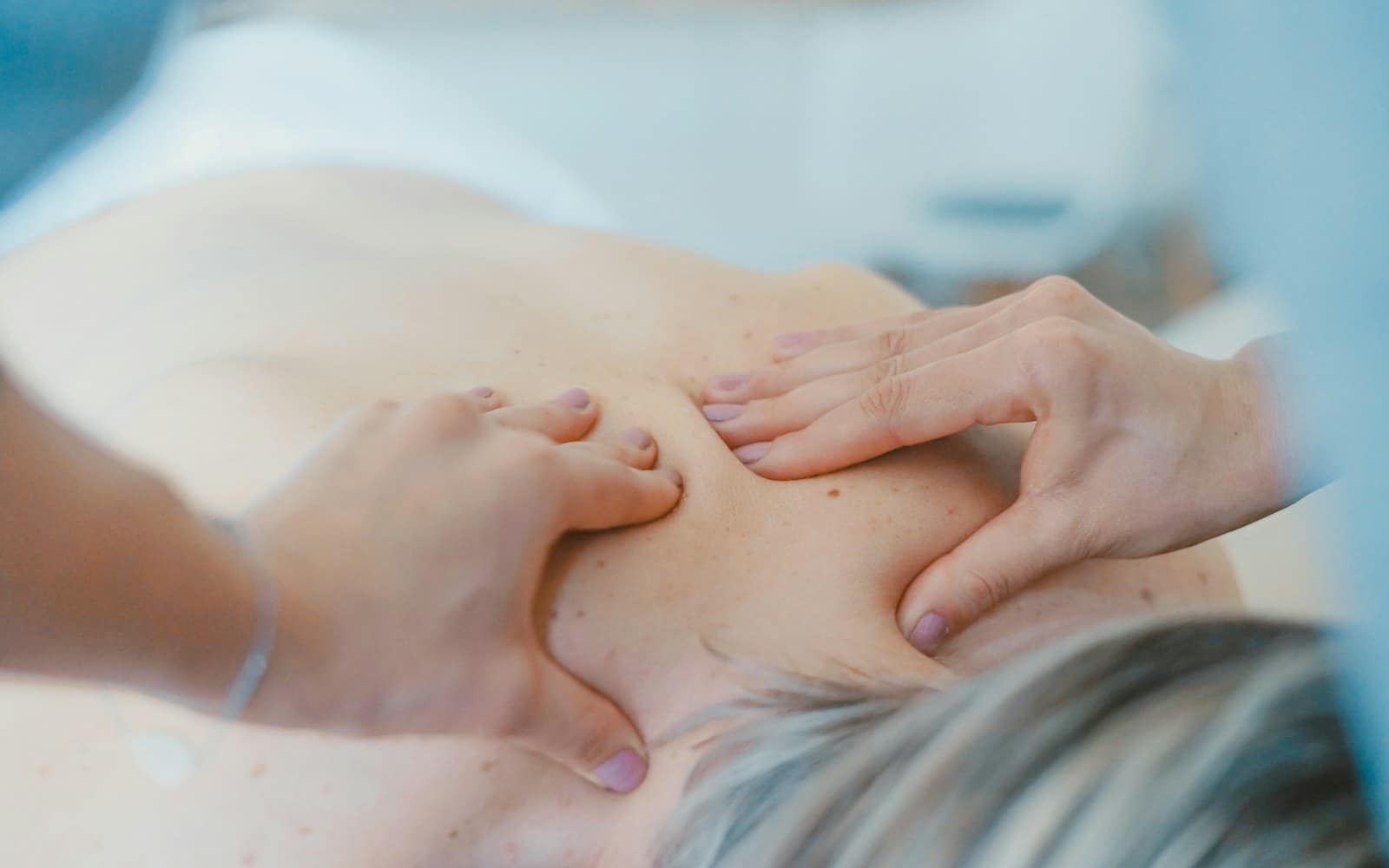 A relaxing back and shoulder massage during a regular wellness session A relaxing back and shoulder massage during a regular wellness session