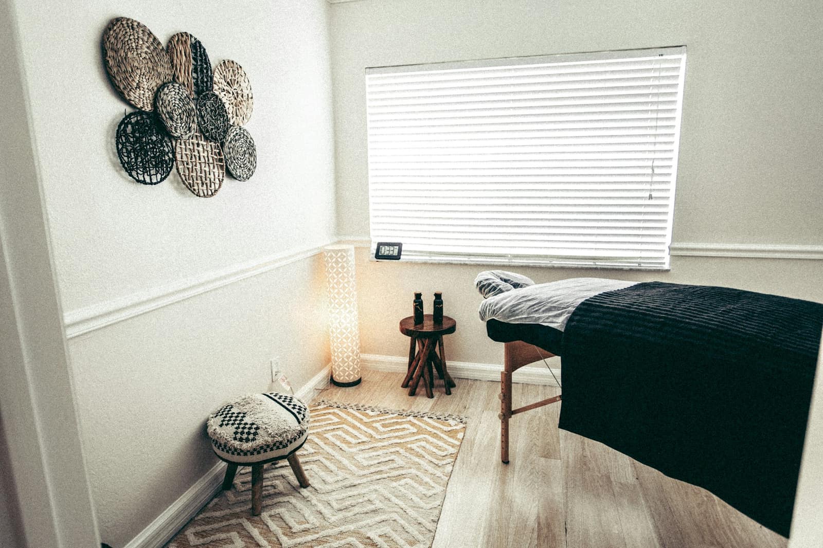 A professional massage table set up in a calm, light-filled room A professional massage table set up in a calm, light-filled room