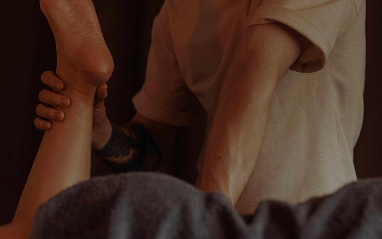 A gentle leg massage during a lymphatic drainage session at home A gentle leg massage during a lymphatic drainage session at home